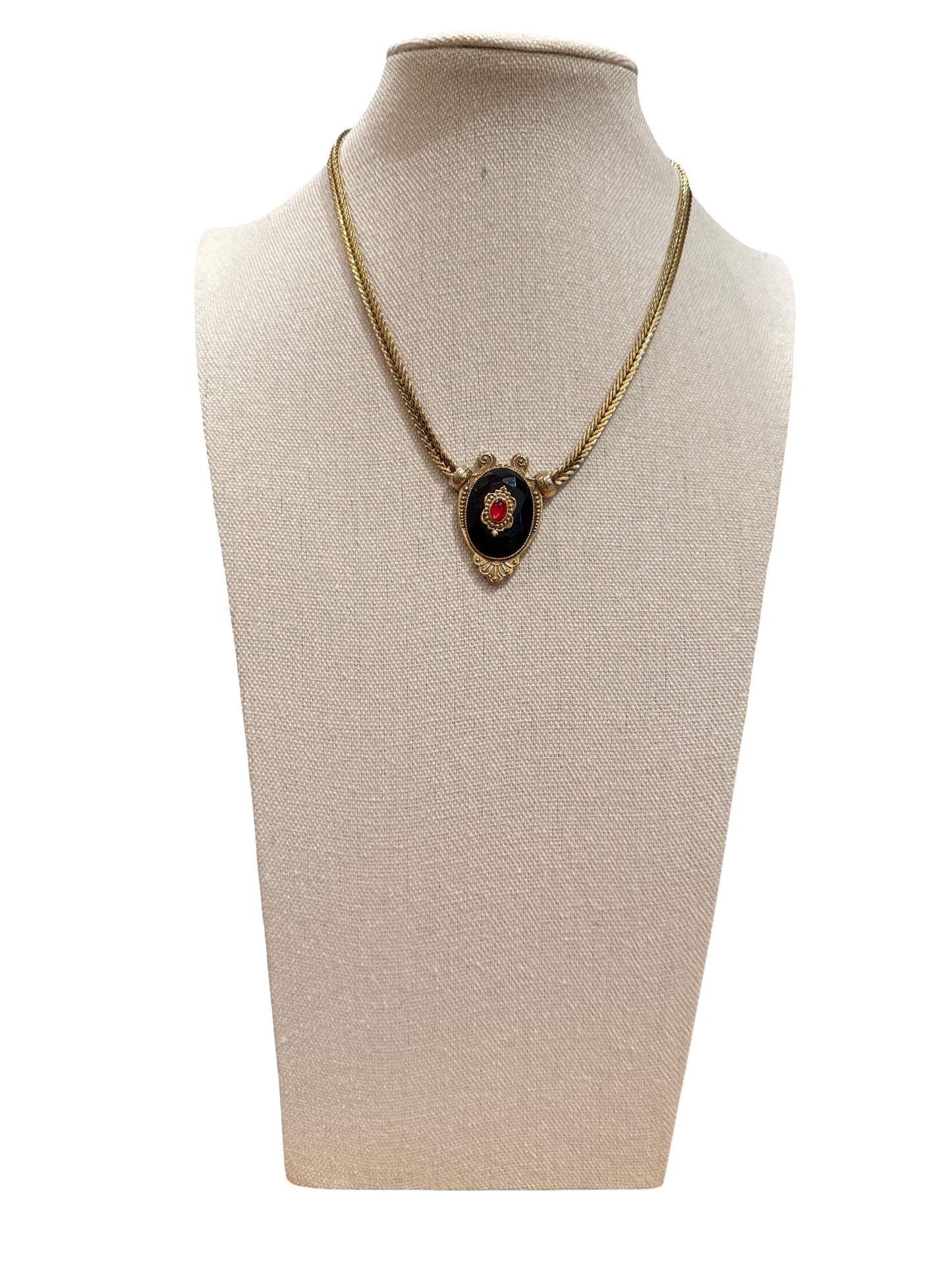 Gold tone necklace with ornate enamel detail