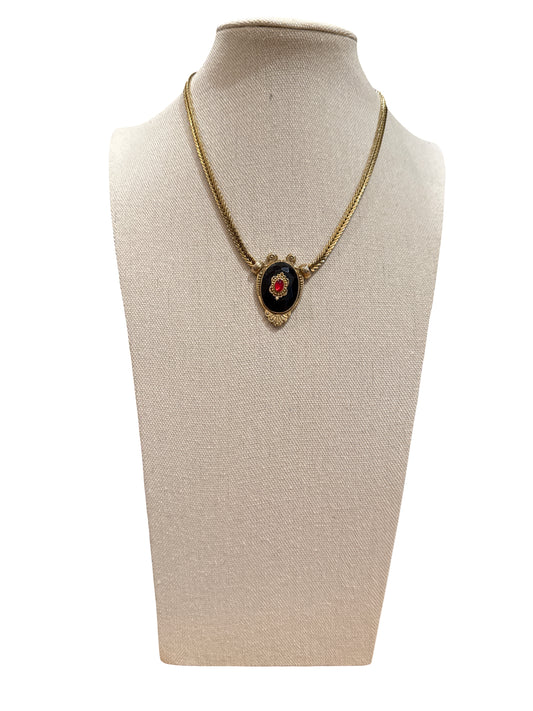 Gold tone necklace with ornate enamel detail